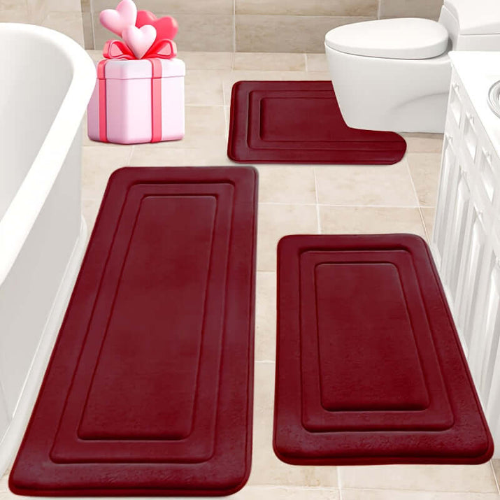 Memory foam bath mat set in deep red color placed in a stylish bathroom with non-slip features for safety.