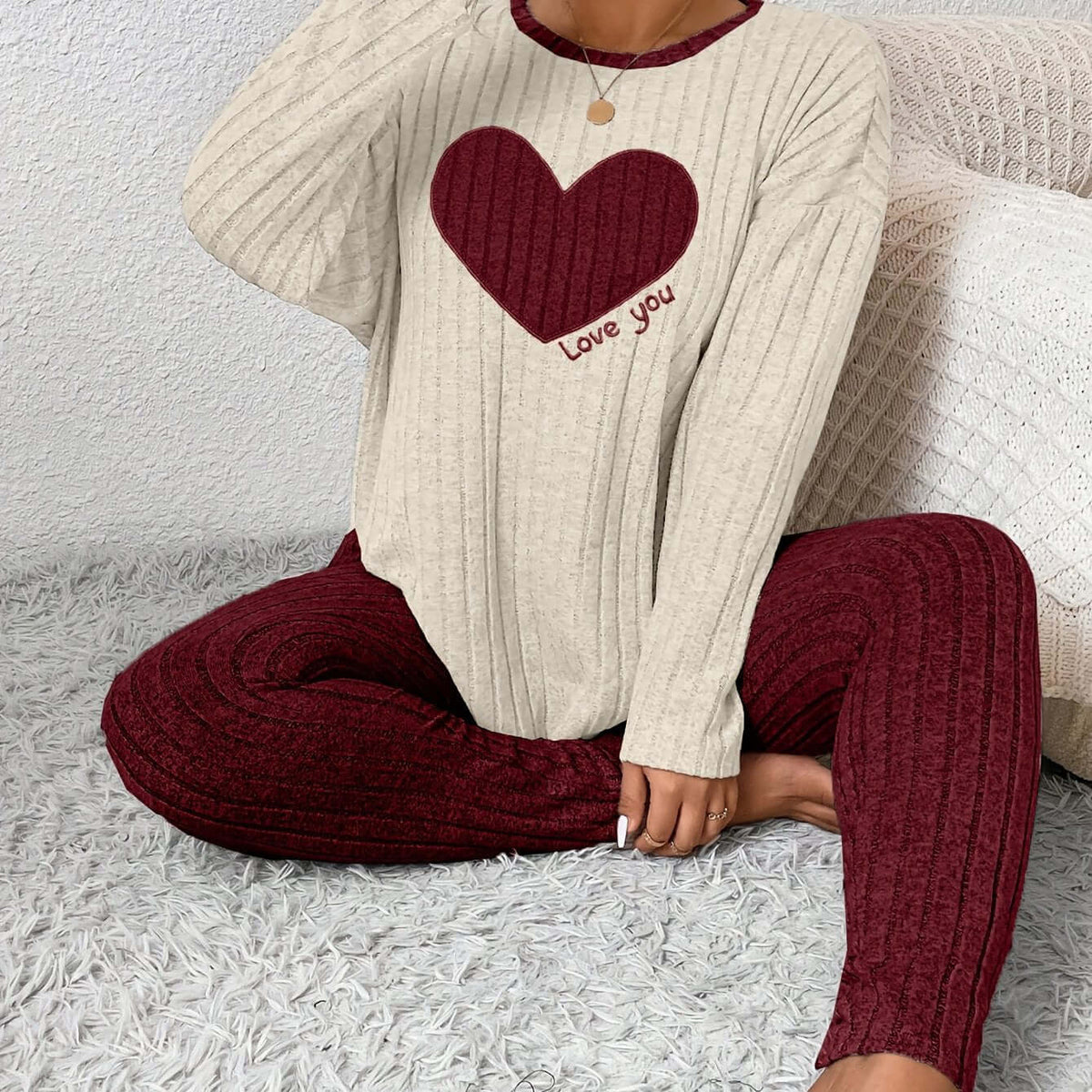 A model wearing plus size heart fitted loungewear featuring a heart design and cozy ribbed fabric.