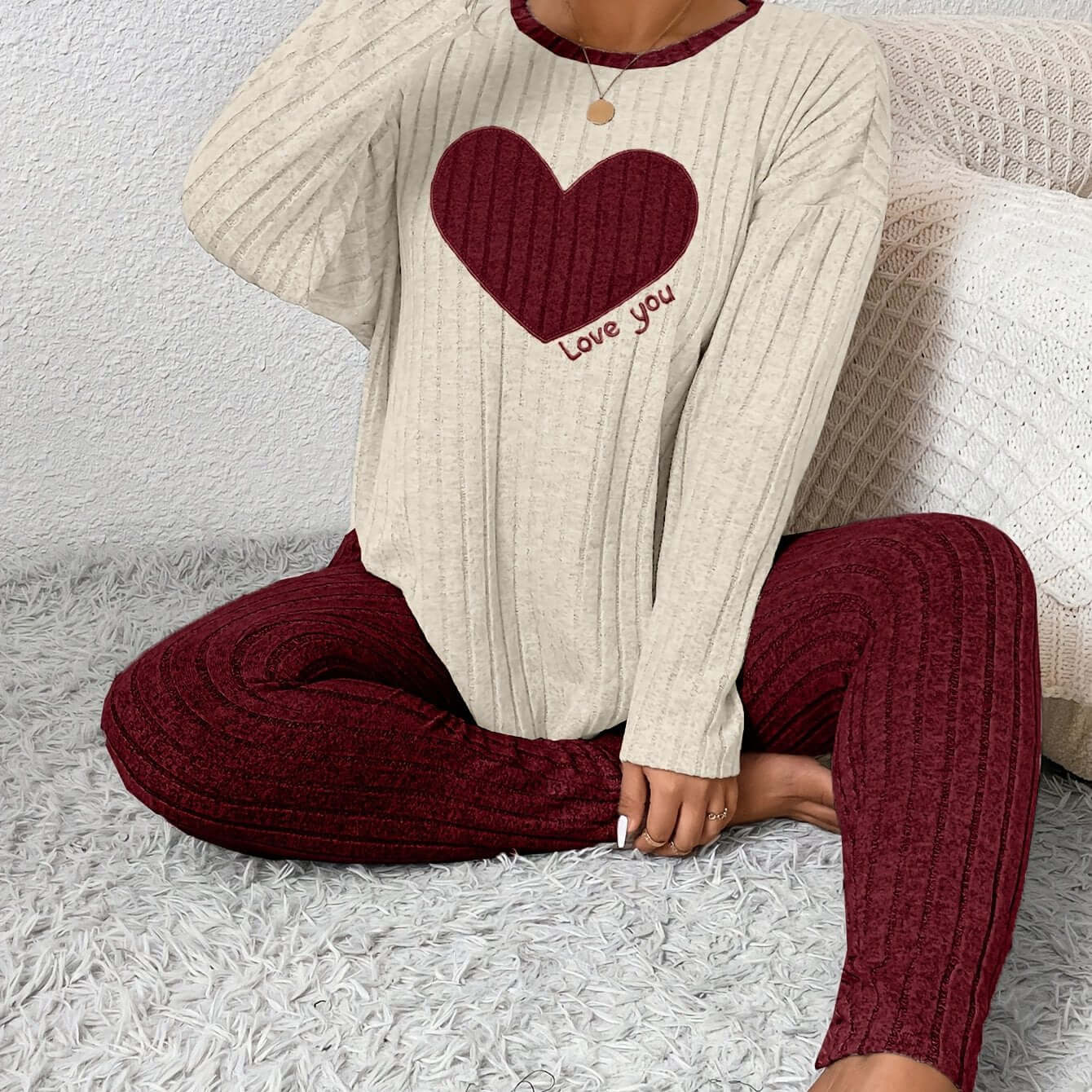 A model wearing plus size heart fitted loungewear featuring a heart design and cozy ribbed fabric.