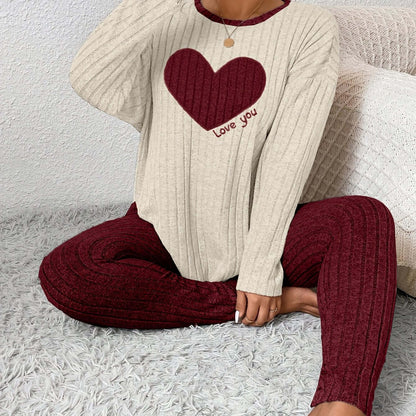 A model wearing plus size heart fitted loungewear featuring a heart design and cozy ribbed fabric.