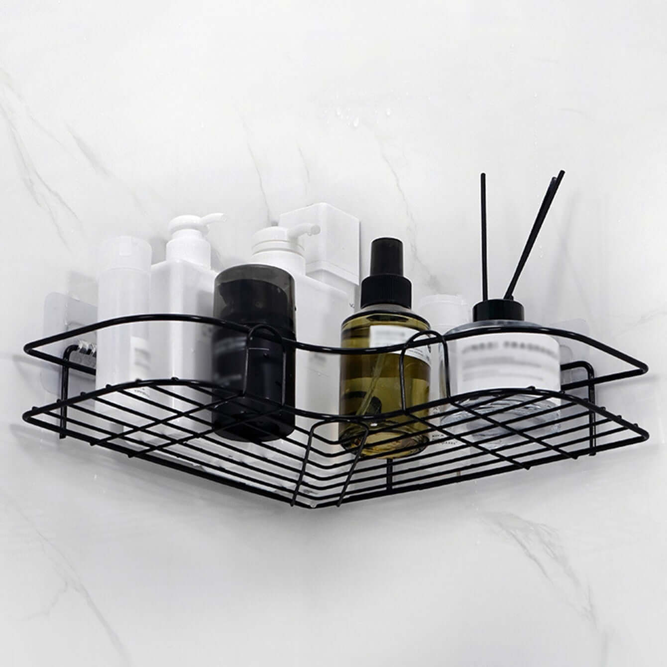 Stylish cast iron shower shelf displaying various bathroom products and accessories for organization.