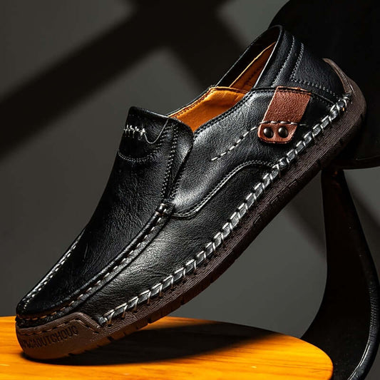 men's slip-on loafers in black leather with decorative stitching and brown accents, stylish footwear for casual occasions