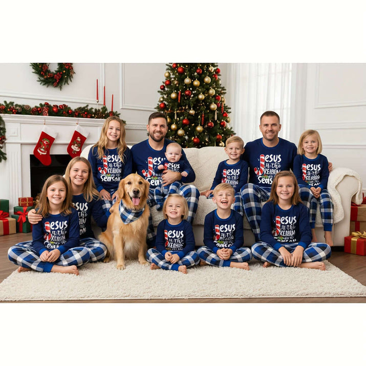 Family matching Christmas pajamas worn by a group of children and adults with a dog, festive holiday setting.