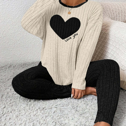 plus size heart fitted loungewear featuring a cozy ribbed top with a black heart and text design paired with black ribbed leggings.