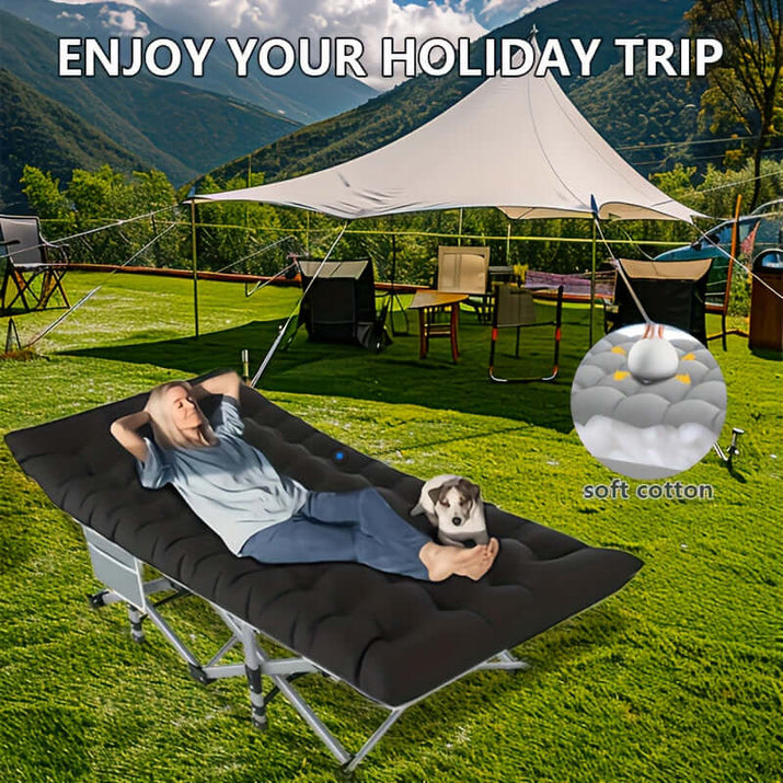 Portable folding guest bed with soft cotton mattress for comfortable outdoor relaxation.
