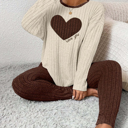 Plus size heart fitted loungewear featuring a cozy beige top with heart design and brown ribbed pants.