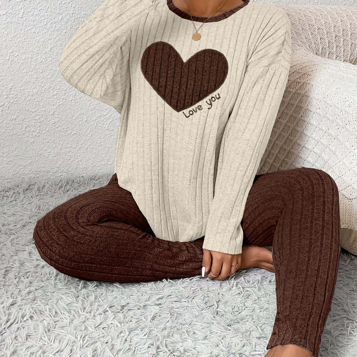 Plus size heart fitted loungewear featuring a cozy beige top with heart design and brown ribbed pants.