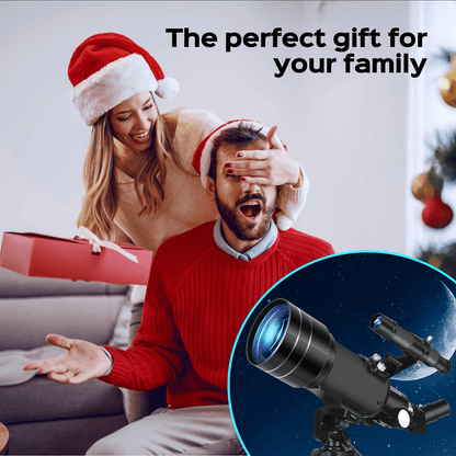 A woman surprises a man wearing a portable 150X telescope with tripod during the holidays.