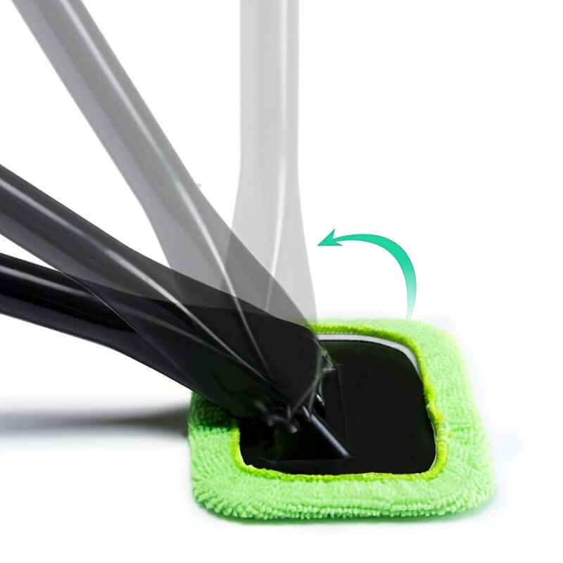 Car window cleaning brush kit with microfiber pad absorbing cleaner for effective window cleaning.