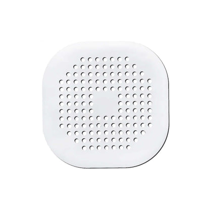 White silicone drain protector for bathroom kitchen with multiple holes for effective drainage.