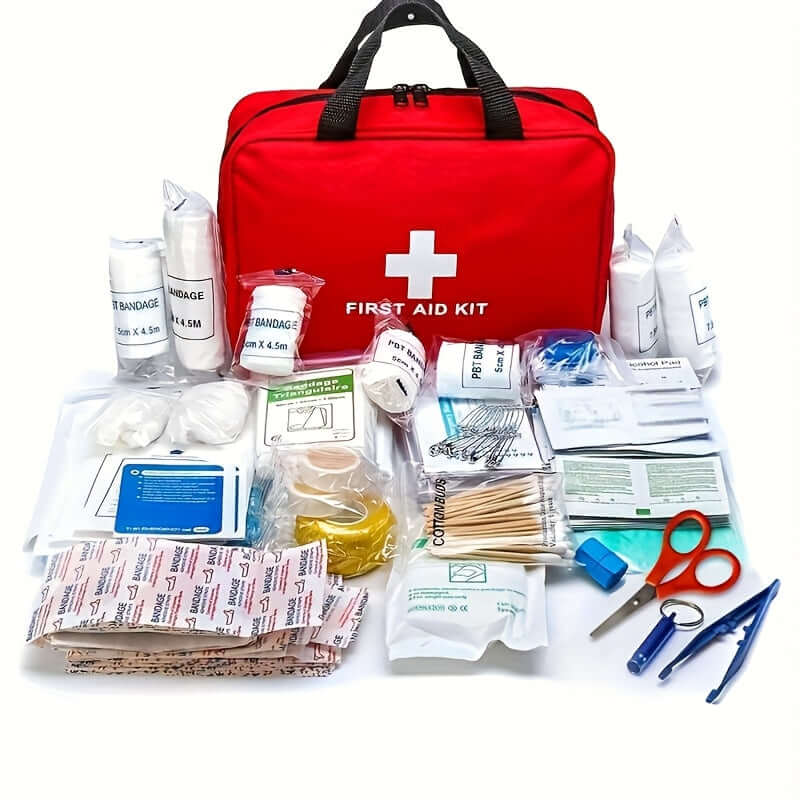 Portable first aid kit for outdoor activities with red bag and various medical supplies.