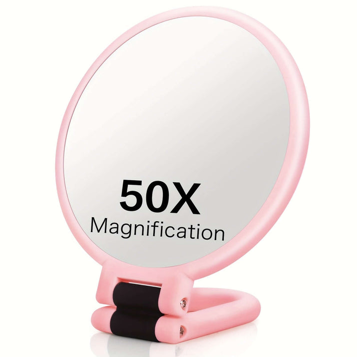 50x magnifying handheld mirror with a round design and pink frame, featuring 50X magnification for detailed viewing.