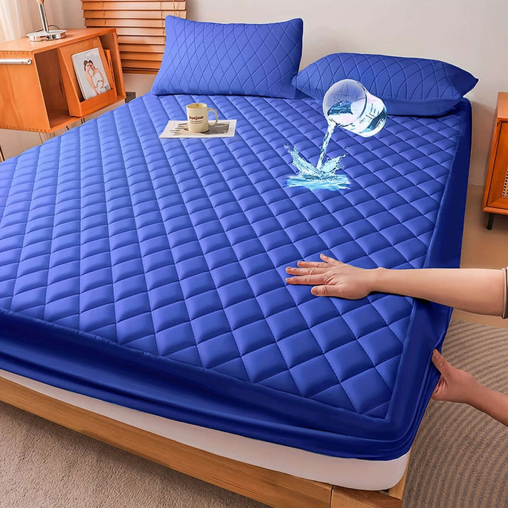 Ultrasonic embossed polyester fabric specifications on a blue mattress cover, showcasing water resistance and comfort.