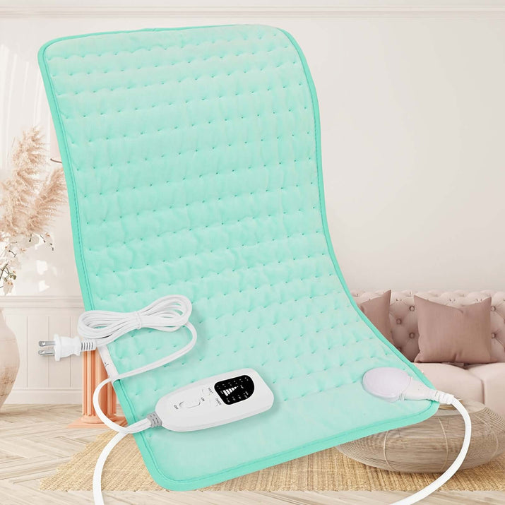 extra large electric heating pad on a cozy chair with control unit and power cord