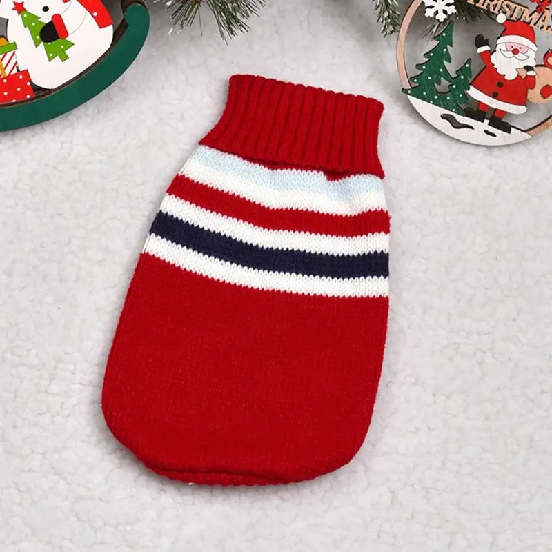 Cute cat sweater costume featuring a red knitted design with white and navy stripes, perfect for pet costumes.