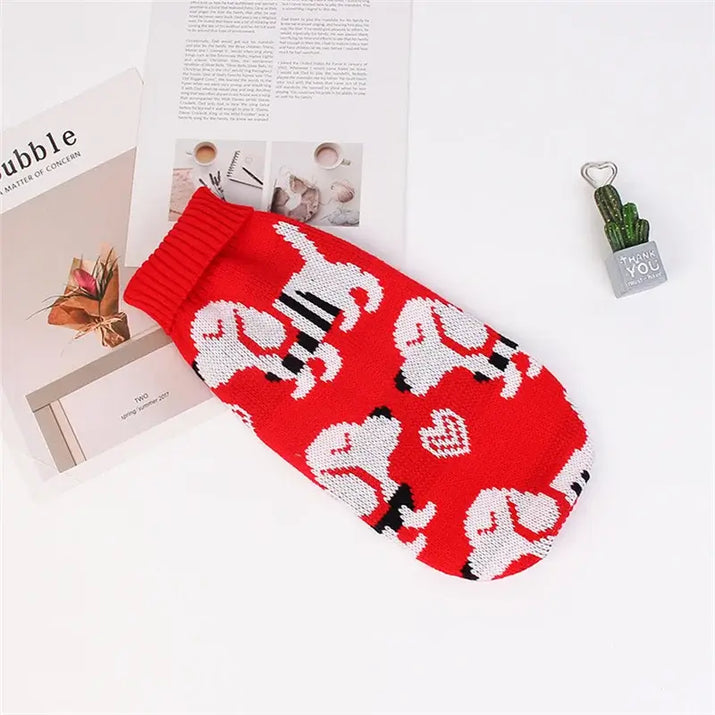 Cute cat sweater costume featuring a red design with playful white cat patterns on a cozy knit material.