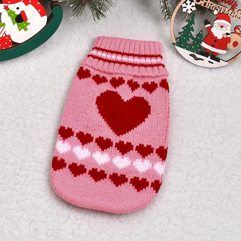 Cute cat sweater costume with pink and red hearts, perfect for keeping furry friends warm during winter.