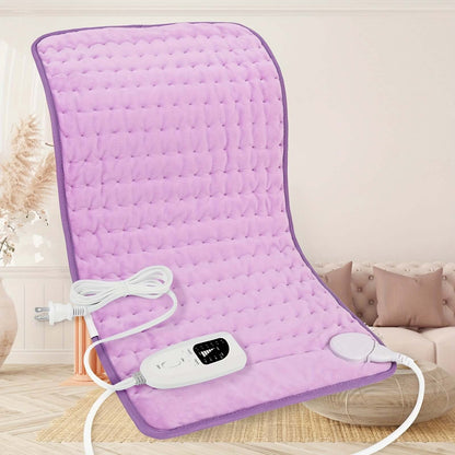extra large electric heating pad in soft purple color with control unit on a cozy living room floor.