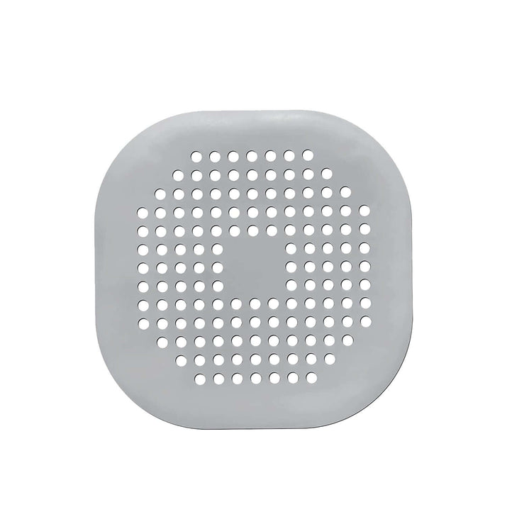 Silicone drain protector for bathroom kitchen, gray circular design with holes for effective drainage.