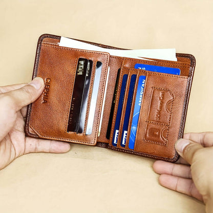 RFID leather wallet for men with multiple card slots and ID window, shown in hand.