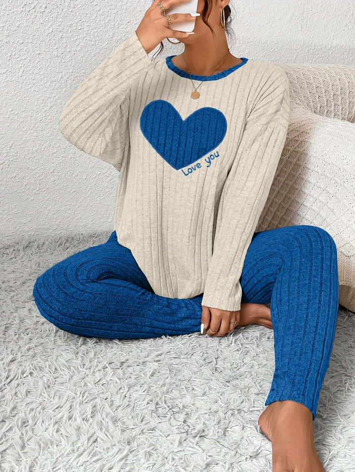 Plus size heart fitted loungewear featuring a cream top with a blue heart and coordinating blue pants, perfect for cozy relaxation.