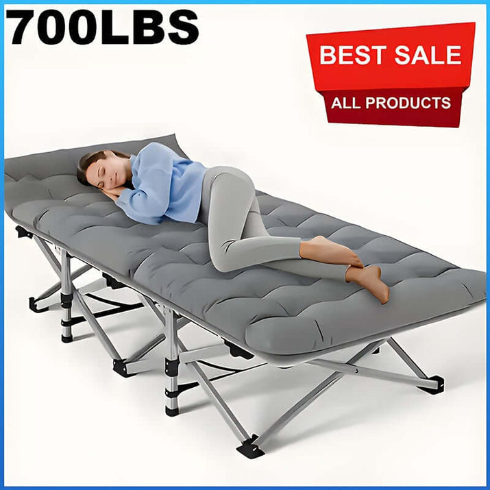 A woman resting on a portable folding guest bed showcasing its comfort and sturdy design, supporting up to 700 lbs.