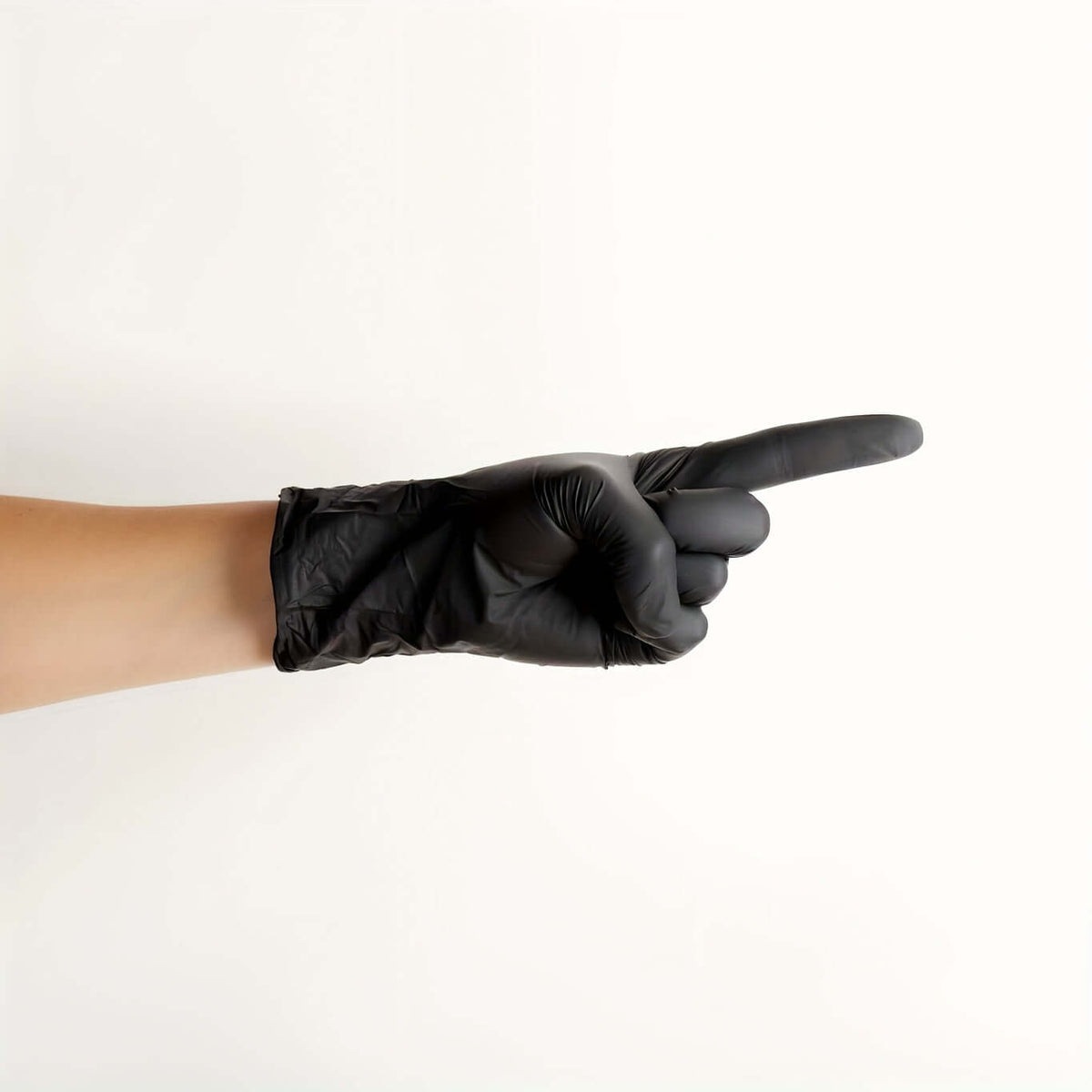 Disposable nitrile gloves for safety - black glove pointing gesture on a white background.