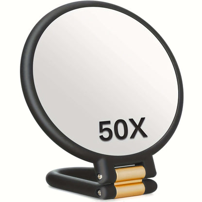 50x magnifying handheld mirror with a sleek black and gold design for close-up viewing.